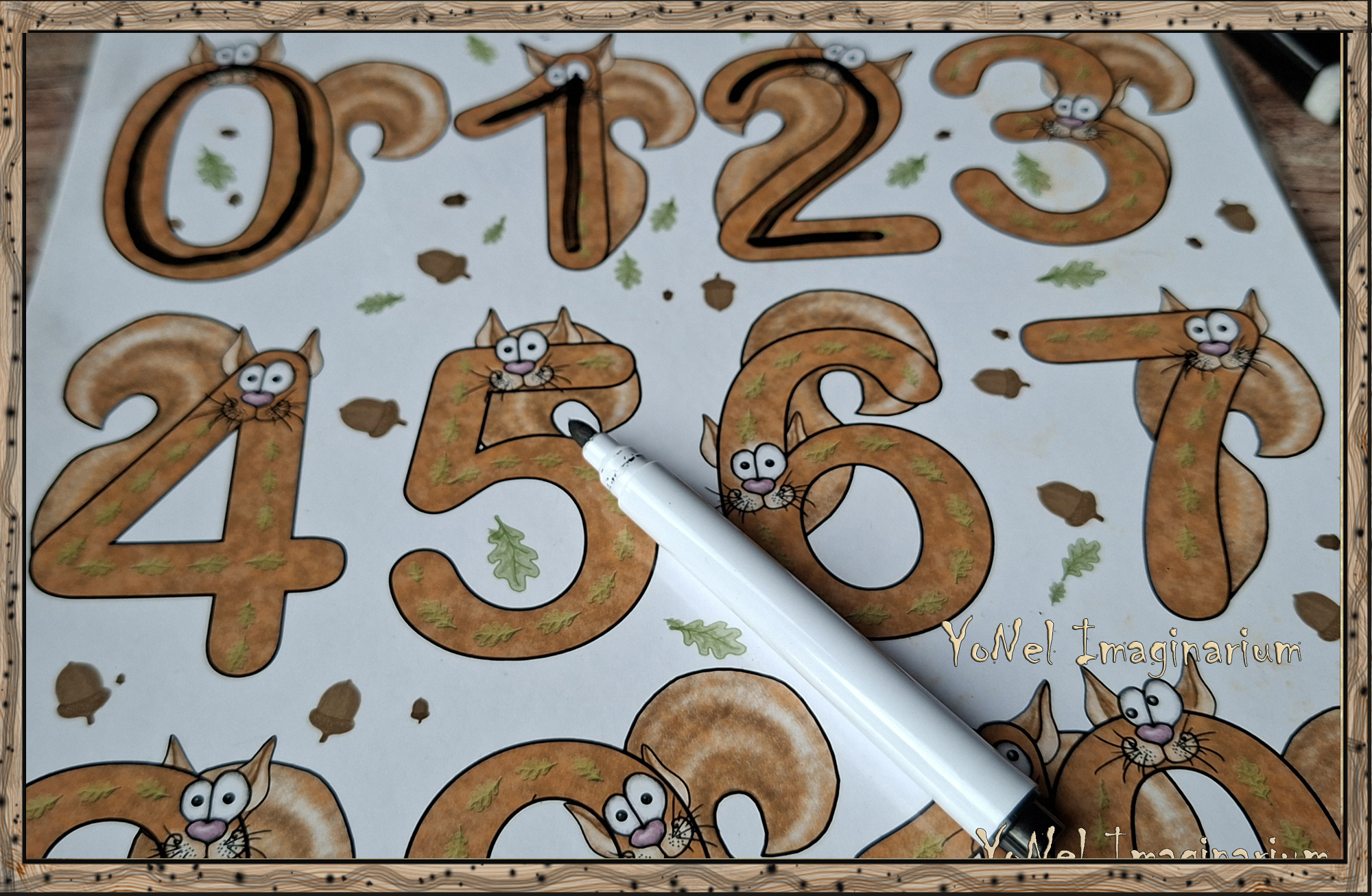 Child tracing numbers with a dry erase marker on reusable number cards featuring Ham the squirrel in a forest-themed math set