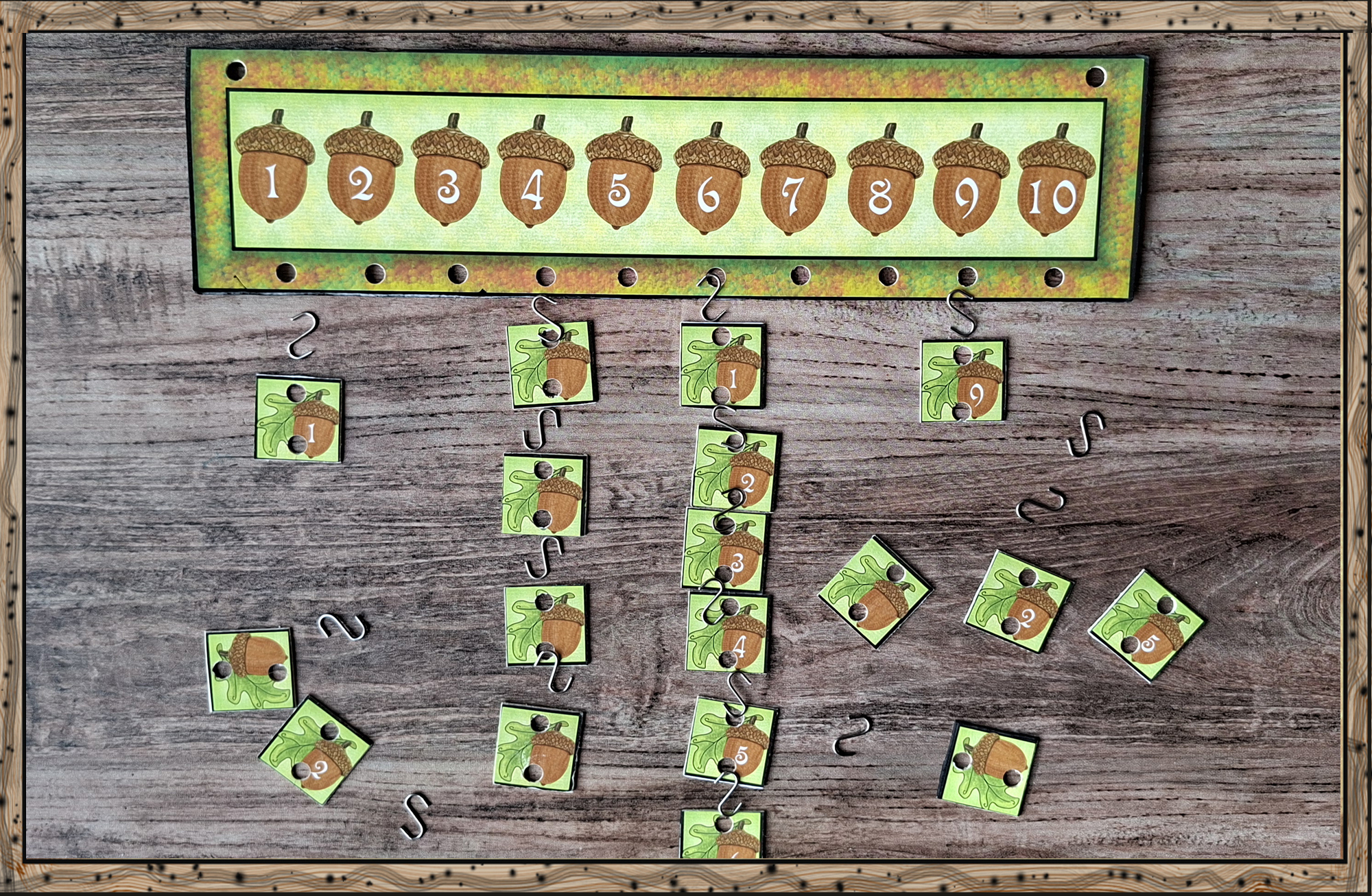Hands-on counting board with hanging acorn number cards from Ham’s forest math set