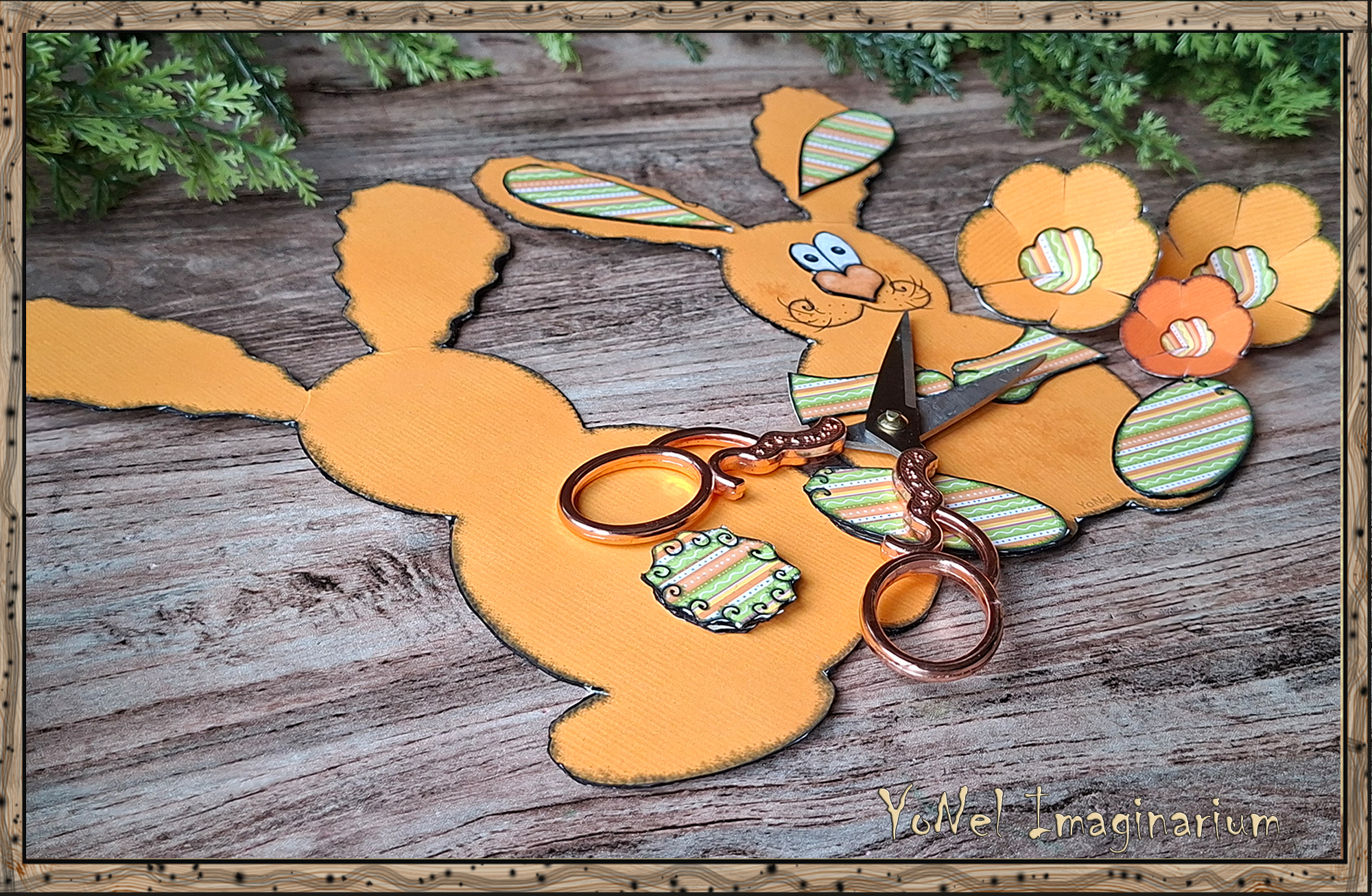 Printable Easter bunny craft template with cut-out paper pieces and scissors on a wooden background, ready for assembly.
